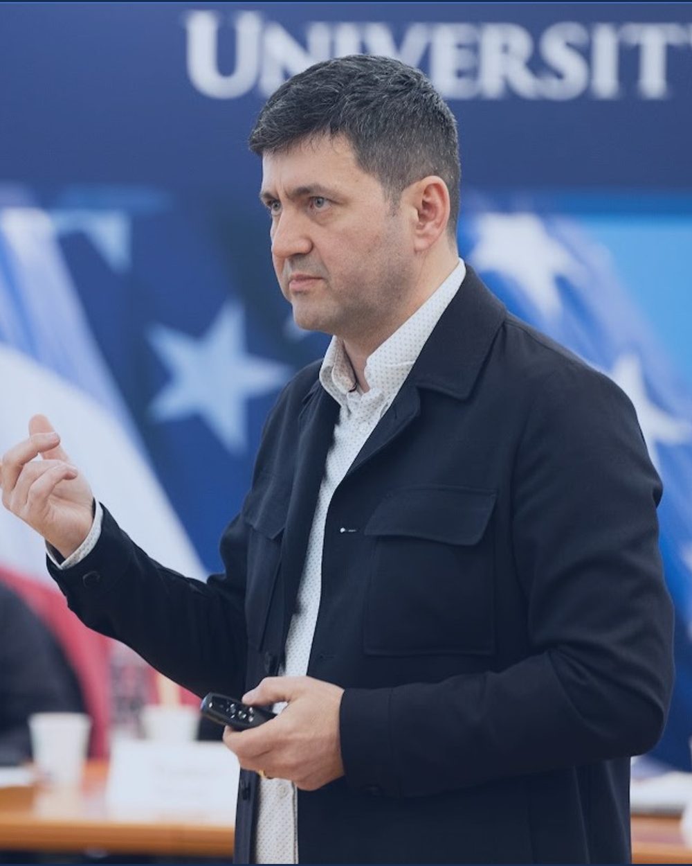 Portrait of Alin Popovici presenting at an executive session